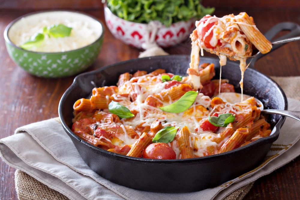 Delicious Chicken and Chorizo Pasta in a creamy tomato sauce garnished with fresh herbs