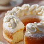 Fluffy Lemon Cake with Whipped Cream and Powdered Sugar Dusting